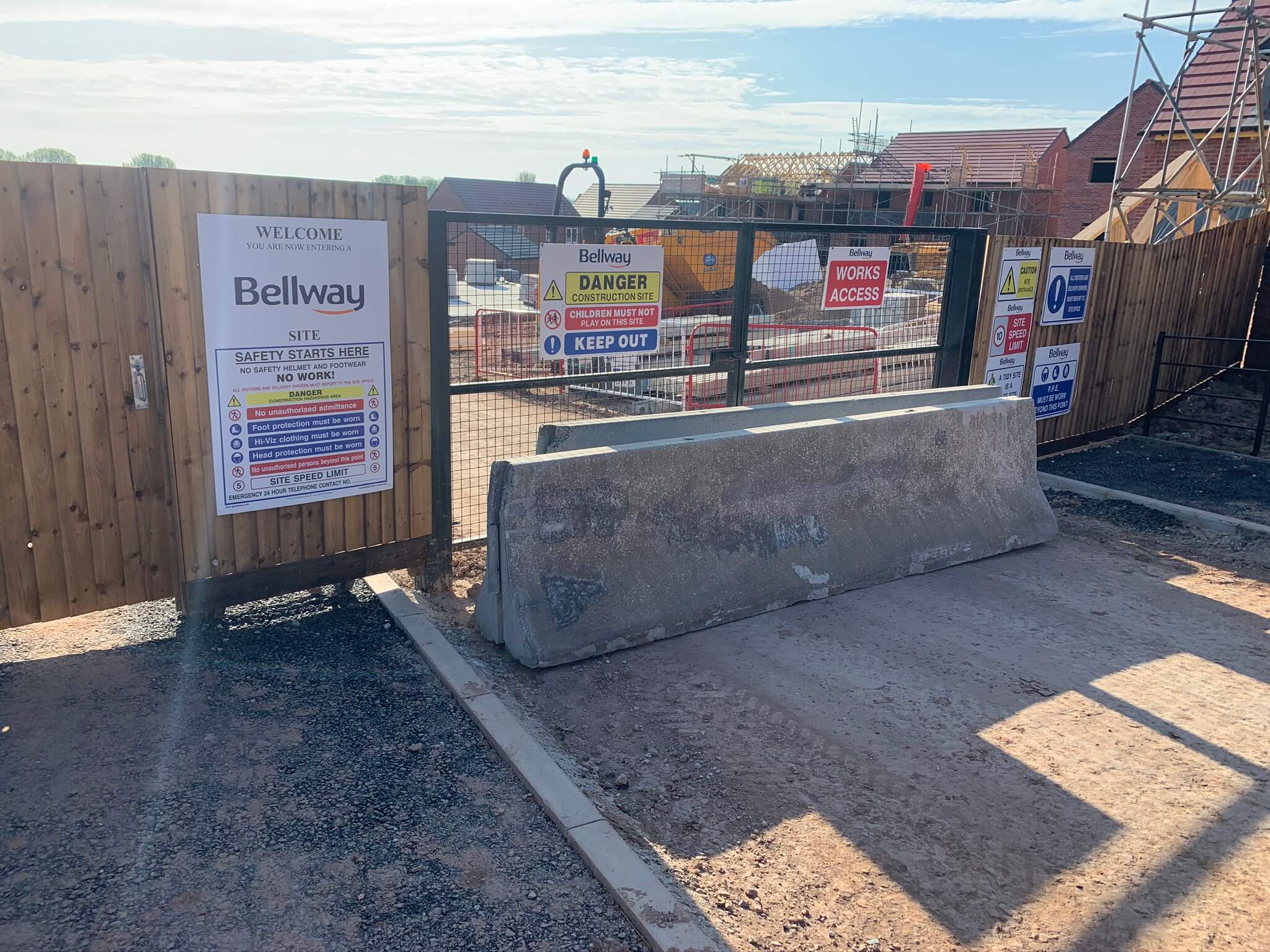 barrier blocking gate with danger signs