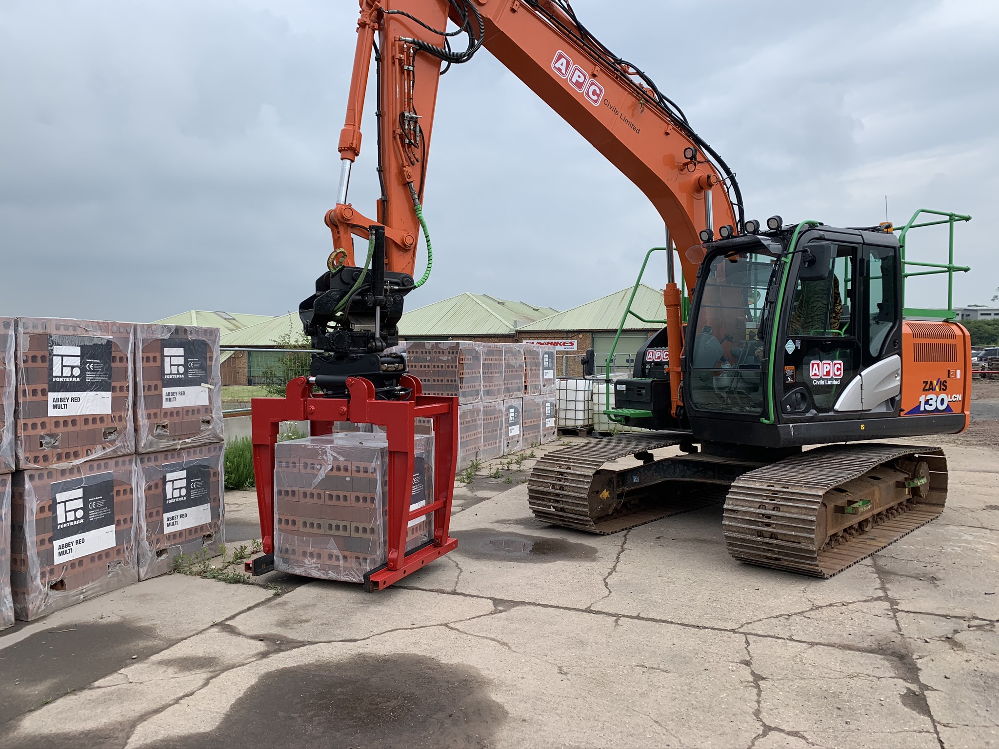 bricks being picked up by machine