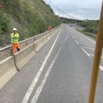 worker next to road