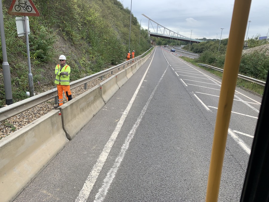 worker next to road